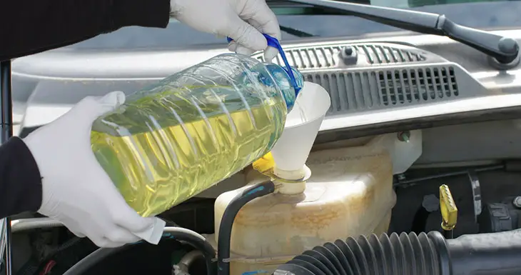 Mechanic-or-Driver-Adding-Coolant-With-Antifreeze-Additive-To-Car-or-Truck-Engine.-Routine-Maintenance-Filling-Up-The-Ethylene-Glycol-Fluids-To-Proper-Levels